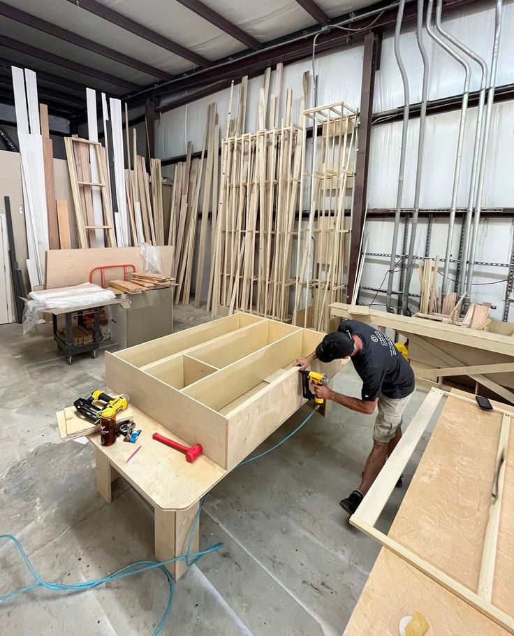 Houseway custom carpentry and modular furniture manufacturing workshop in Hyderabad, featuring a craftsman building custom cabinetry.