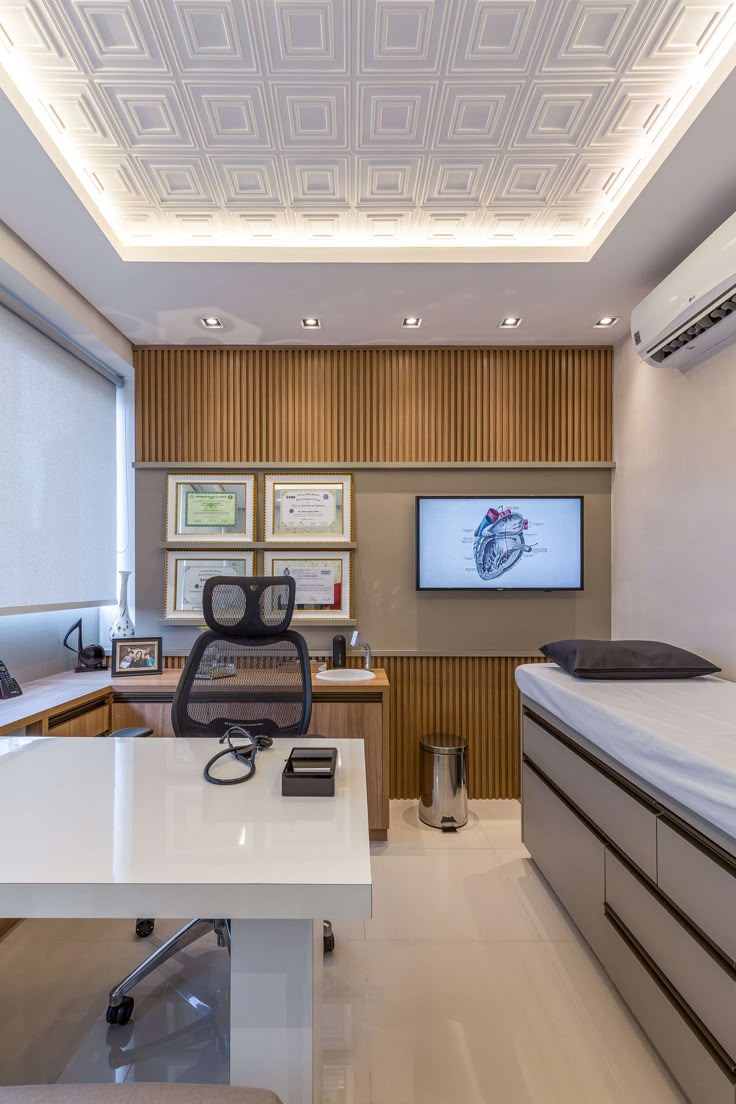 Houseway professional clinic and hospital interior design services in Hyderabad, featuring a modern medical consultation room, examination bed, fluted wood paneling, and coffered lighting.