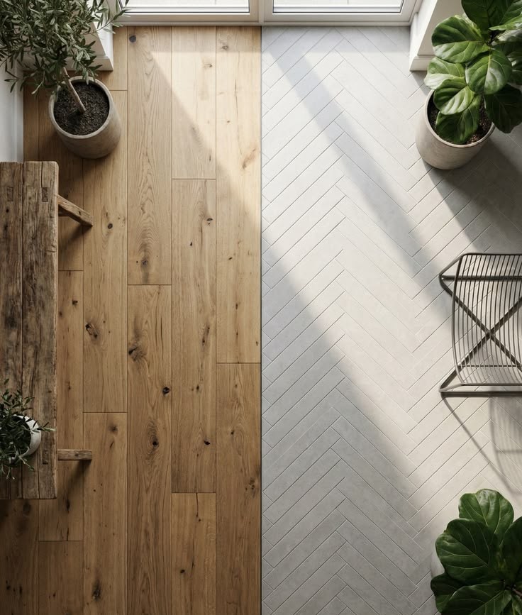 Houseway professional flooring design and installation services in Hyderabad, showcasing a split transition between natural hardwood planks and white chevron-patterned tiles.