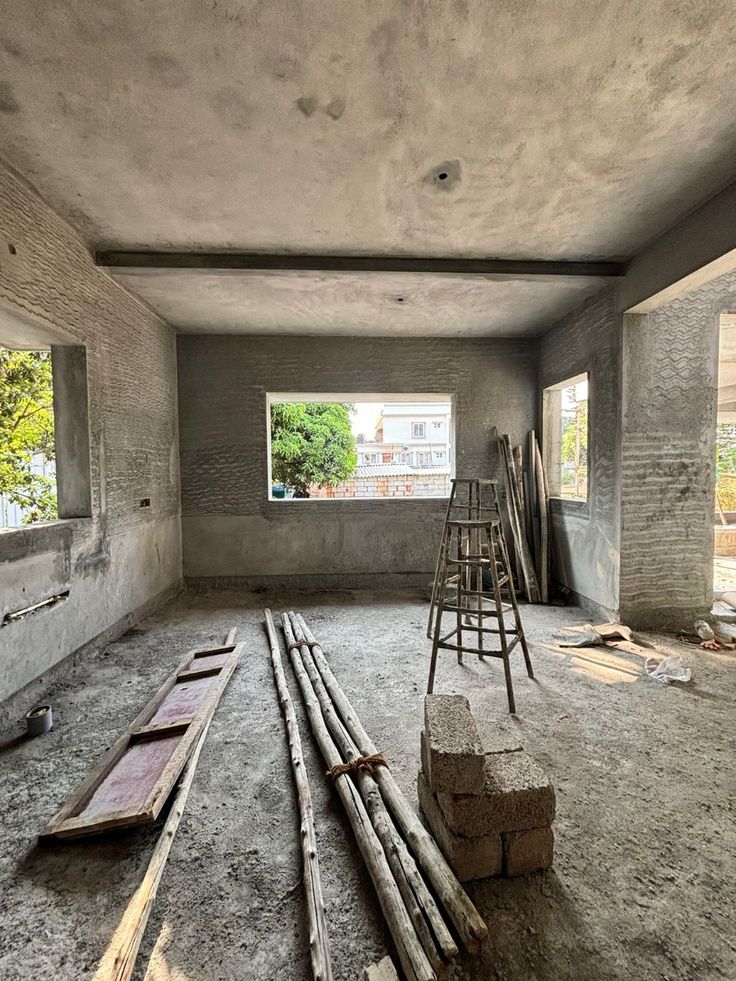 Houseway civil construction and interior rough plastering stage services in Hyderabad, featuring an active residential building site with newly textured cement walls, wooden scaffolding poles, and a wooden ladder.