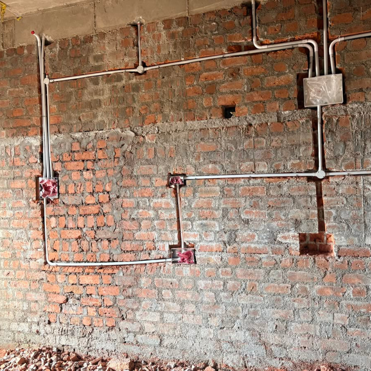 Houseway electrical lighting and ceiling wiring construction planning services in Hyderabad, featuring a multi-grid compilation of architectural floor electrical layouts, false ceiling conduit installations, modular switch panels, and ambient wall lighting fixtures.