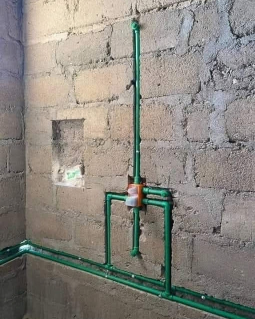 Houseway bathroom plumbing installation and sanitary design services in Hyderabad, featuring a multi-panel visual guide of a professional plumber installing a sink trap, exposed PVC water supply pipe networks, drainage schematics, finished bathroom interiors, and rough-in wall plumbing.